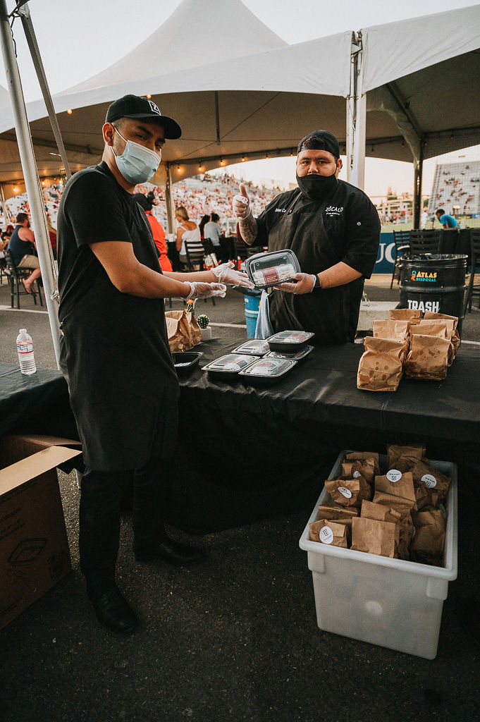 Zócalo staff handing a pre-package burrito