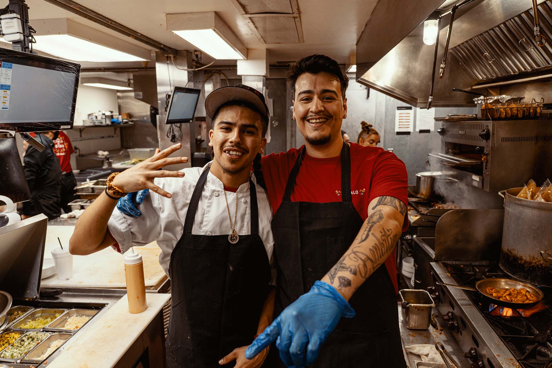 Zócalo kitchen staff taking a photo while smiling